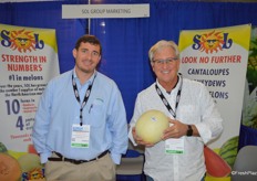 BJ Milligan and Bernie Henderson with Sol Group Marketing. Bernie shows a Honeydew melon from Guatemala. Product from Honduras will be available in about three weeks.